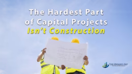 Construction professionals reviewing building plans representing capital project planning and decision making before construction.