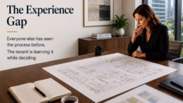 Executive reviewing workplace plans during an office relocation project while evaluating design and occupancy decisions before construction begins.