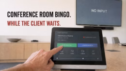 A hand presses "Start Meeting" on a conference room touch panel showing "Source Not Detected" while the display behind reads "No Input," illustrating a client meeting delayed by AV technology failure.